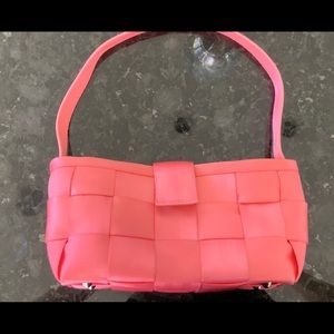 Harvey’s bright pink seatbelt shoulder bag